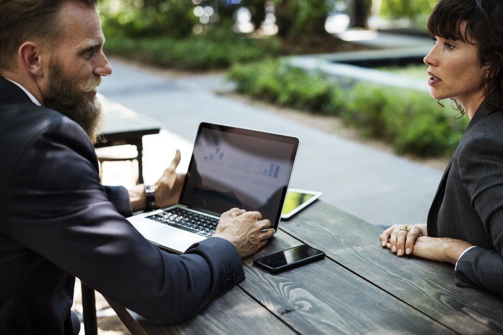 Two business people talking at a table